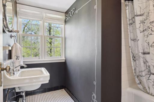 The fourth bedroom features a private full bathroom ensuite.