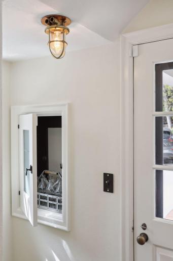 The original milk door with cartons inside.