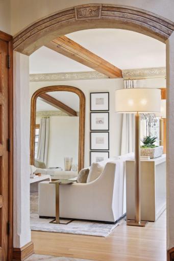 Your eyes will draw you to the many stylish features of the home including the archways, light fixtures, floor details, and so much more.