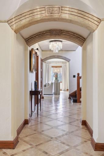 Your eyes will draw you to the many stylish features of the home including the archways, light fixtures, floor details, and so much more.