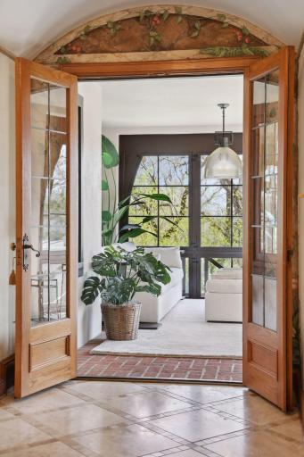 The veranda is located off of the foyer with wonderful views of the backyard.
