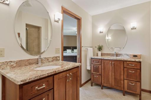 Elegant primary bathroom showcasing custom dual vanities.
