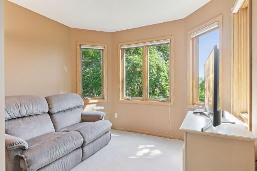 A cozy sitting area in the primary suite offers the perfect spot to relax and recharge.