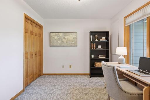 This main-floor 5th bedroom doubles perfectly as a private office or guest room.