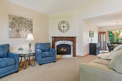 One of two fireplaces, the living room offers a cozy and inviting space to unwind.