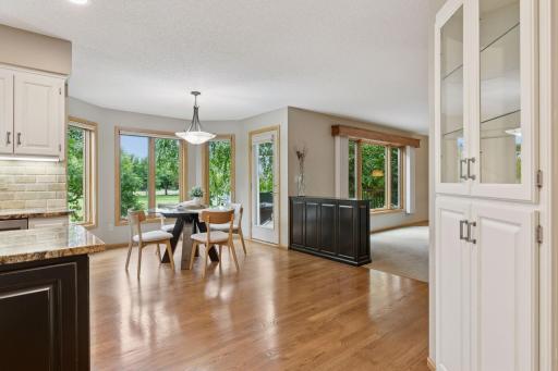 An open flow connects the kitchen to the sunlit dinette, perfect for casual dining.