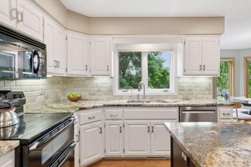 Enjoy serene views of the private backyard right from the kitchen window!