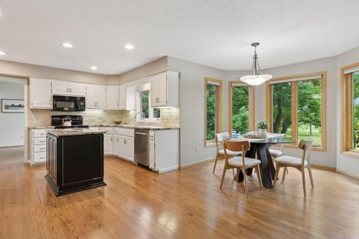 An open flow connects the kitchen to the sunlit dinette, perfect for casual dining!