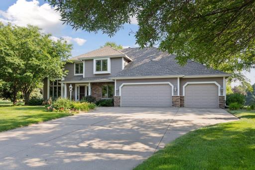 Beautiful curb appeal on a spacious corner lot, featuring a newer roof, updated siding and windows, and a durable concrete driveway.
