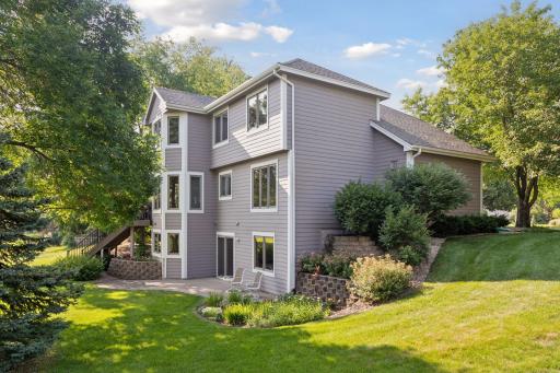 The home is beautifully landscaped, creating an inviting and picturesque setting.