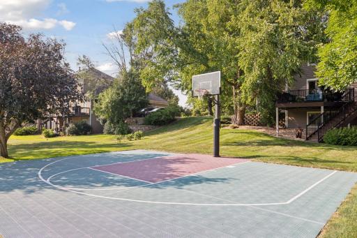 This versatile sport court can be enjoyed for basketball, pickleball, or other sports - or easily transformed into a serene private zen retreat with a pergola and comfortable seating to soak in the golf course and peaceful backyard views.