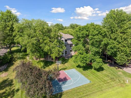 Enjoy a generous half-acre corner lot with plenty of space for outdoor activities, featuring your own sport court and stunning views of Prestwickâs iconic 16th hole