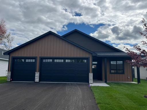 Welcome to 719 Margaret Lane NE in Isanti. A 16' front porch greets you! Interior photos are of a similar model home.