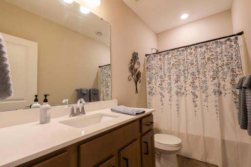 Full bath lower level right between both bedrooms.
