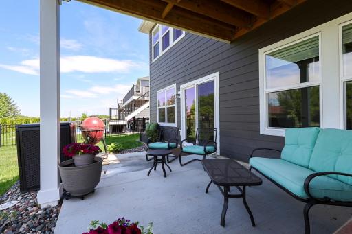 Concrete patio offers great summer shade with water remediation system under deck to direct rain water to downspout.
