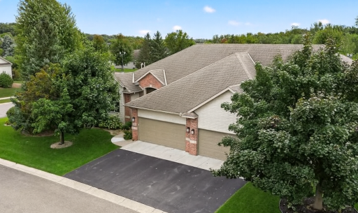 Introducing 11001 Preserve Circle N! This custom built exceptional townhome is situated in the highly sought after Meadows of Elm Creek community. Adjacent to wetlands and Elm Creek Park Reserve this is a nature lovers dream!