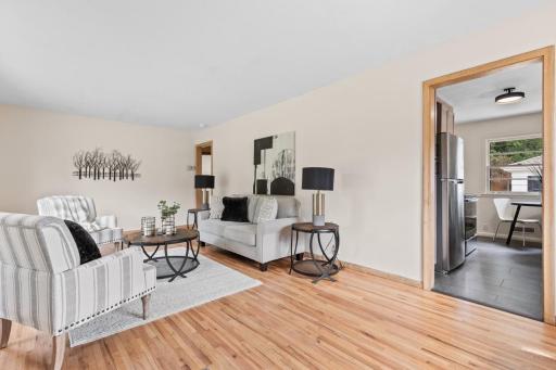 Updates include: new light fixtures, fresh carpet, refinished hardwood floors, and interior/exterior paint