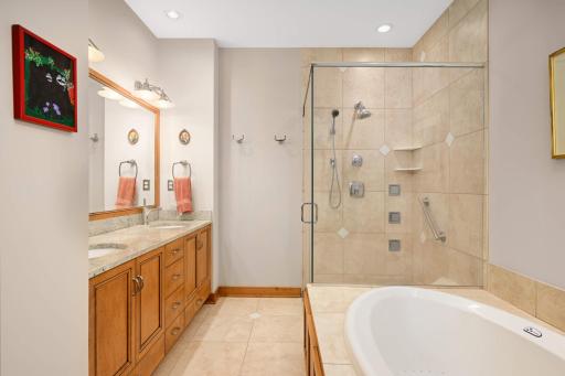 The luxurious Primary bath features a separate shower & soaking tub