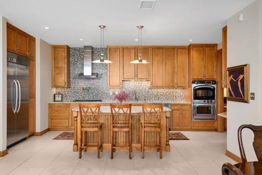 The gourmet, center island kitchen offers very high-end specialty SS appliances