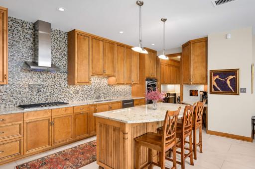 A roomy breakfast bar is a great gathering spot