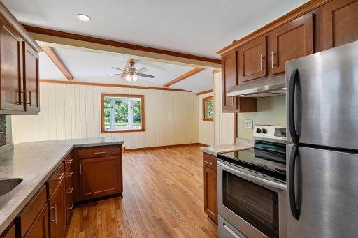 Kitchen overlooks the Dining Room and the screened porch.