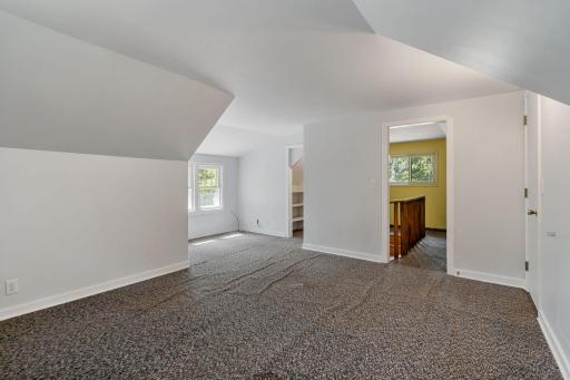 Upper level bedroom is massive and has light pouring in from all sides.
