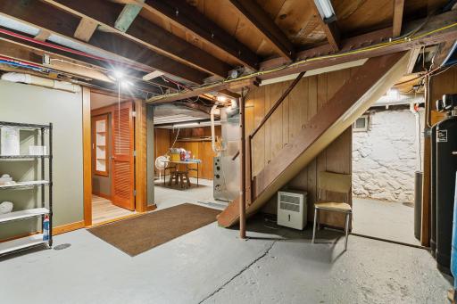 The lower level has tons of storage and room for a workshop!