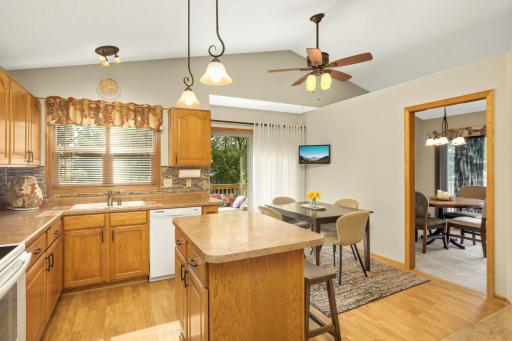 Bright Kitchen with Breakfast Nook and Center Island. A walk-out to small deck.