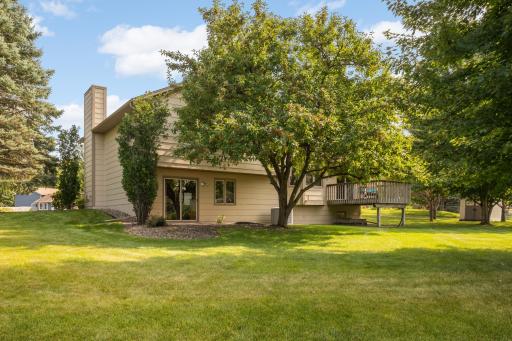 Back of the home with walk-out and deck