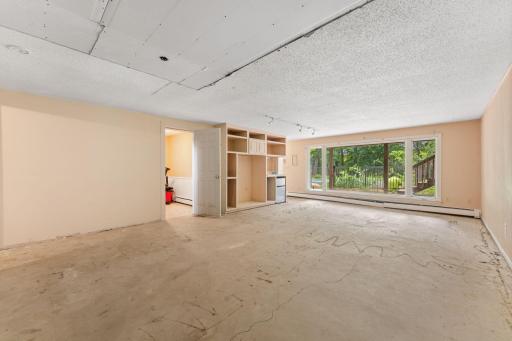 Very large family room with panoramic outdoor views and access to the patio.