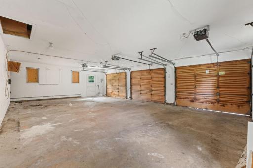 Supersized 3 car garage with heavy wooden doors!