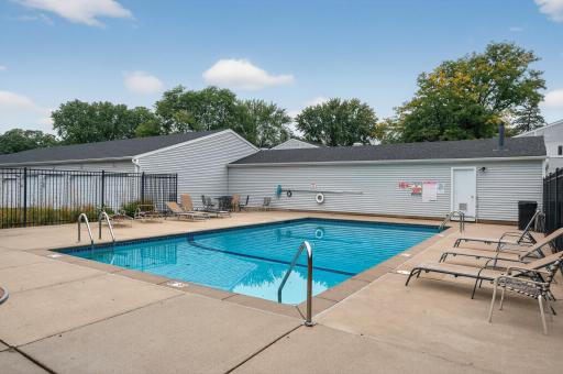 The heated outdoor pool is shared by the association