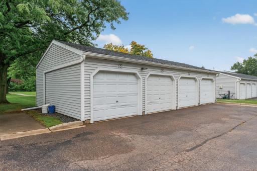 The unit includes one garage stall and space in the lot for an additional vehicle.