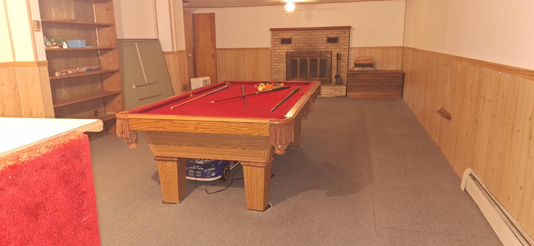 Large lower level family room. Pool table is negotiable.