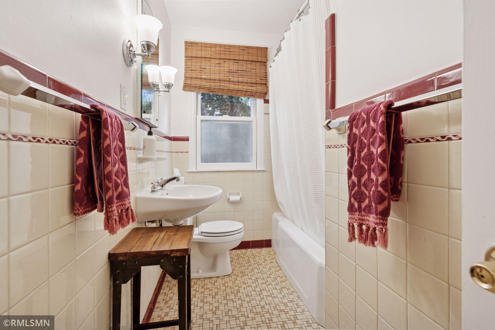 Charming main floor bath is original and in excellent condition