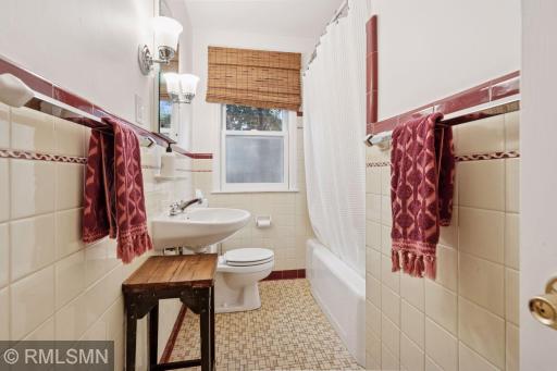 Charming main floor bath is original and in excellent condition