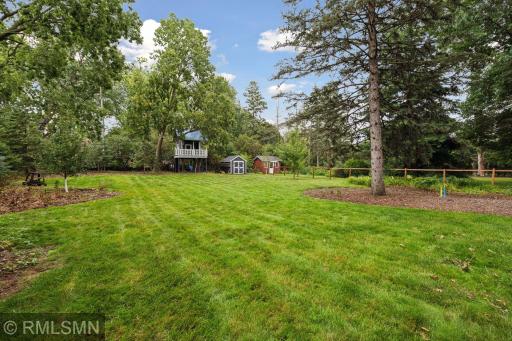 Gorgeous flat backyard. Storage shed and your own treehouse!