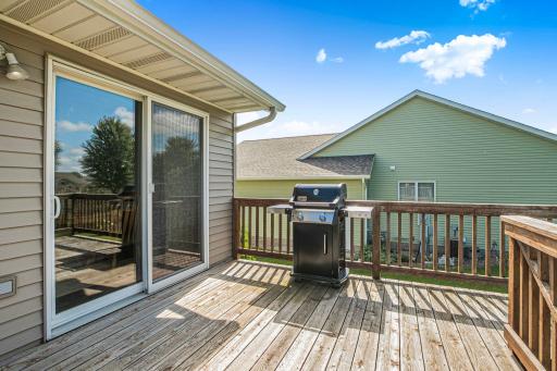 Convenient deck off the dining area, perfect for grilling and hosting, with easy flow between indoor and outdoor living.