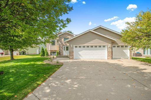 This home shines with its wide driveway, mature shade trees, and landscaped surroundings—perfect for enjoying the outdoors or welcoming friends and family. The balanced design blends curb appeal with functionality.