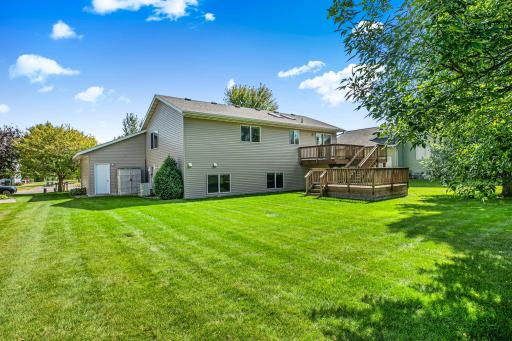 The homeâs exterior showcases two decks and plenty of green spaceâperfect for entertaining, gardening, or simply enjoying the outdoors.