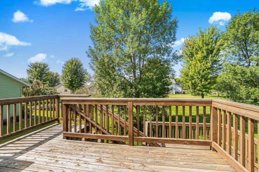 A private escape right outside your doorâthis deck provides direct access to the shaded, open backyard.