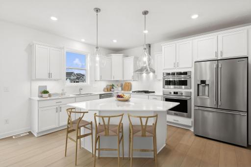 (Photo of model home, features may vary) The kitchen naturally operates as the heart of this home, offering ample countertop space and brand-new appliances that will inspire attempts at new recipes.
