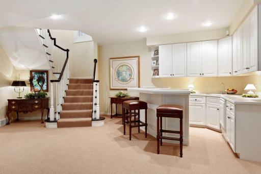the lower level offers an expansive and wonderful second living area