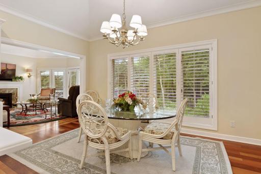 with private views to the serene back yard, the kitchen opens to the cozy family room with new fireplace mantel surround and new lighting fixtures