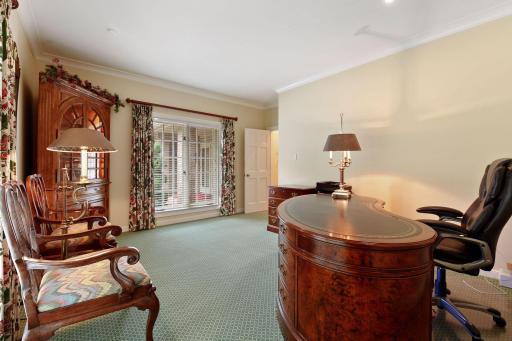 The second bedroom on the main floor is currently being used as a main floor office with new carpeting