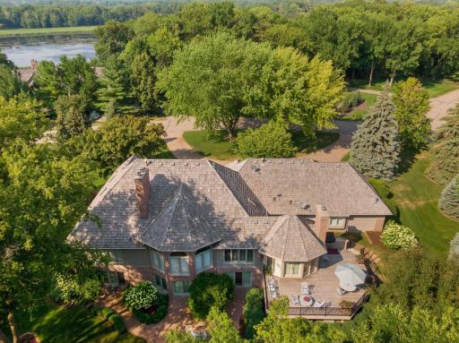 Stunning French Country brick rambler nestled within a serne and private enclave and yet just minutes to Wayzata, Lake Minnetonka, the Dakota Trail, and the Minnetonka Art Center