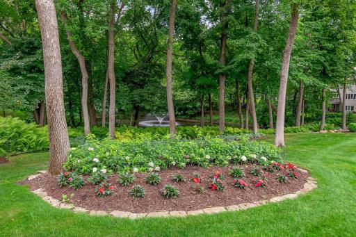 Multiple new gardens and plantings enhance the view with the pond and the fountain adding peaceful sounds and a relaxing setting to enjoy - there is also a perfect bonfire pit overlooking the pond