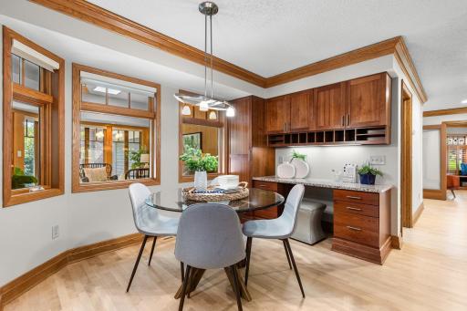 Informal Dining Area off of Kitchen with a Custom Built-in Desk and Cabinet