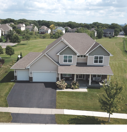 1135 Moers Classic two-story with a grand front porch. Aerial view shows surrounding green space. City park is behind home. The park acts as an extension of your yard when you are relaxing, playing, or entertaining.