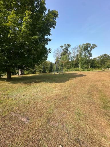 This property includes the solitude of a private drive and a wooded lot!